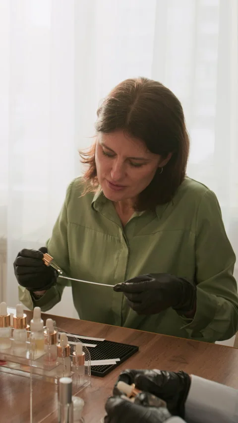 Middle Aged Woman Perfumer Smelling Fragrance on Scent Strip Stock-Footage 337115234