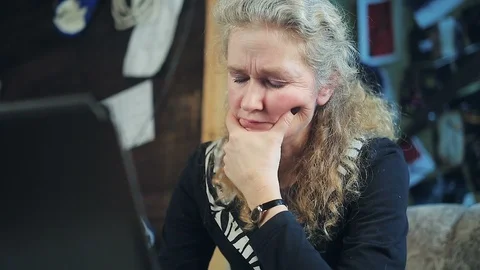 Middle-aged woman working on a computer Stock Footage 98634690