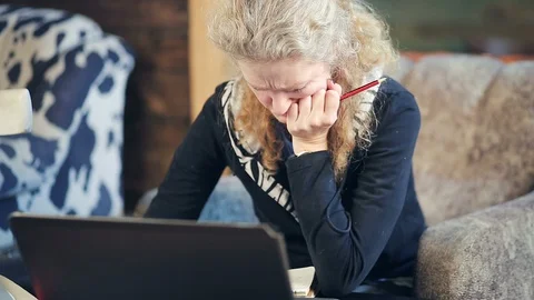 Middle-aged woman working on a computer Stock Footage 102153100
