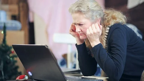 Middle-aged woman working on a computer Stock Footage 102153213