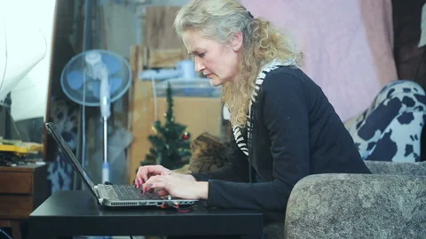 Middle-aged woman working on a computer Stock Footage 150432267