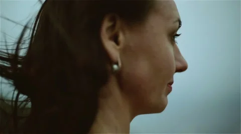 A middle aged woman's face in a windy weather. Slow motion Vídeo Stock 65501538