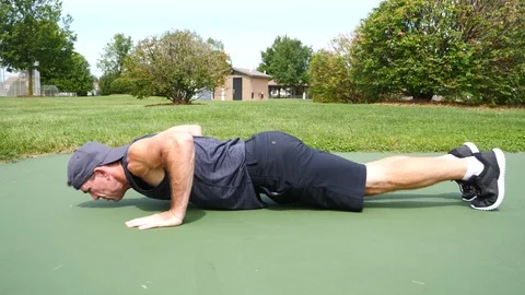 Middle aged young man push ups exercise at the park, 4k, 60fps. Stock Footage 115273326