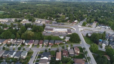 Middle Class Neighborhood With Traffic At Intersection Aerial Drone View Stock Footage 121191751
