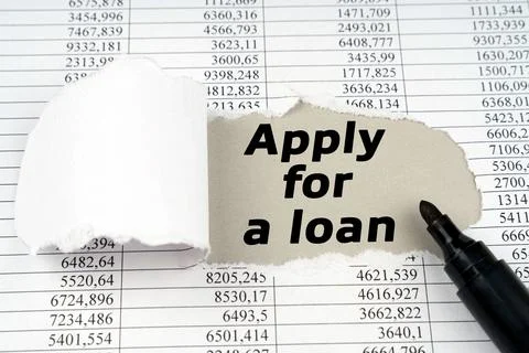 In the middle of the document with financial statements, there is a hole wi.. Stock Photos