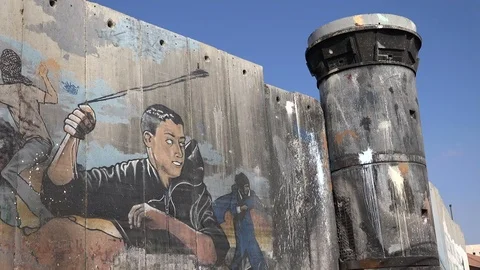 Middle East politics, graffiti art on separation wall West Bank Stock Footage