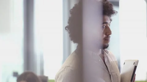 Middle Eastern Business man using tablet PC in office Stock Footage 67345322