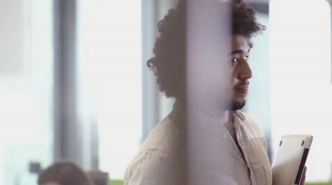 Middle Eastern Business man using tablet PC in office Stock Footage 67345764