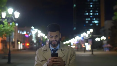 Middle Eastern businessman typing message on smartphone Видео 104411447