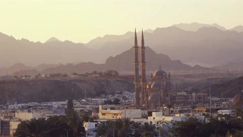 Middle Eastern City With A Mosque And Minarets Against A Background Of Mountains Stock Footage 217674697