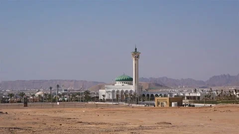 Middle Eastern City With A Mosque In A Desert Area With Distant Mountains View Stock Footage 218579971