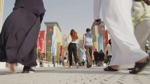 Middle eastern couple with child walking at the entrance of EXPO 2020 Stock Footage 171120568