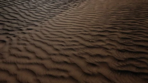Middle eastern desert landscape with shadow patterns from sunlight near Stock Footage 238911245