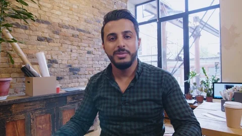 Middle Eastern Designer Presenting Interior Plan on Tablet at Camera Stock Footage 115914665