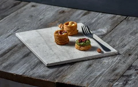 Middle Eastern dessert with on a stone plate Stock Photos
