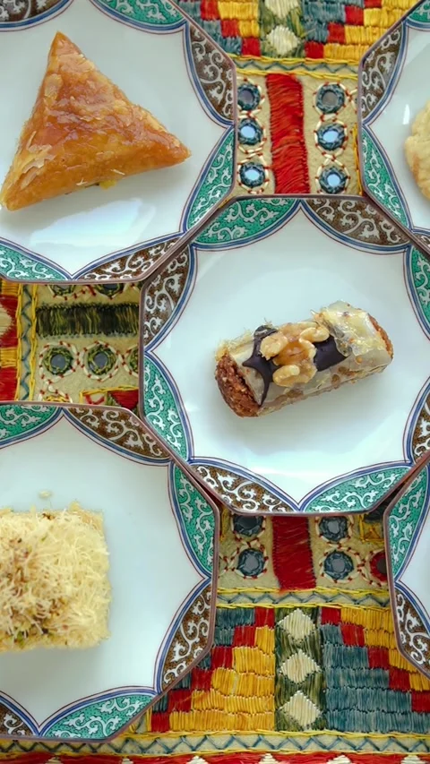 Middle Eastern Desserts Baklava And Chebakia On Exotic Tablecloth Stock Footage 335042173