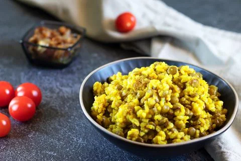 Middle Eastern dish, Mujadara of lentils, rice, fried onions on dark backgrou Stock Photos