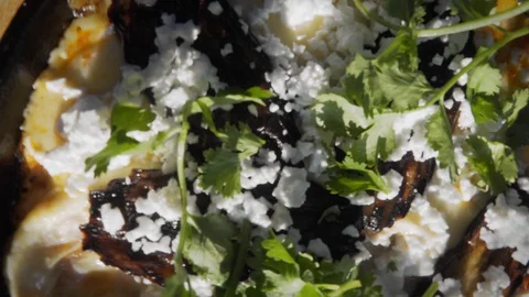 Middle Eastern Dish Shakshuka Served in Frying Pan. Top Rotating Shot Video stock 102176329