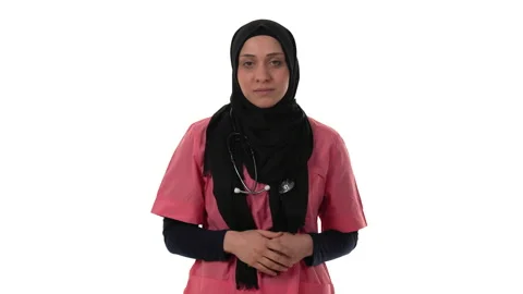 Middle eastern doctor is smiling and showing the peace sign. Isolated on a white Stock Footage 168802096
