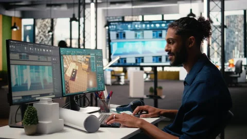 Middle eastern engineer finalizing interior design plans for a building 動画素材 316794525