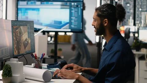 Middle eastern engineer finalizing interior design plans for a building Foto stock