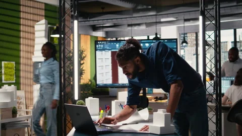 Middle eastern engineer reviewing construction site measurements Stock Footage 316796029