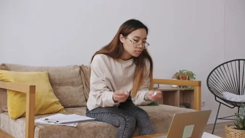 Middle Eastern female remote working from home, having a video call with Stock Footage 148878359