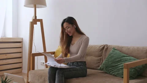 Middle Eastern female remote working from home, having a video call with Stock Footage 149845462