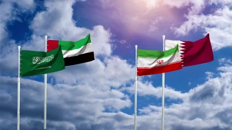 Middle Eastern flags waving majestically in the wind under a cloudy sky Stock Footage 334925614