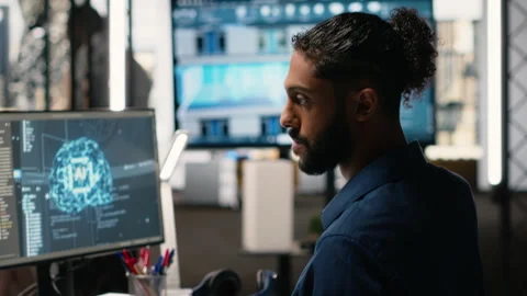 Middle eastern guy uses AI neural networks for urban redevelopment Stock Footage 316646516