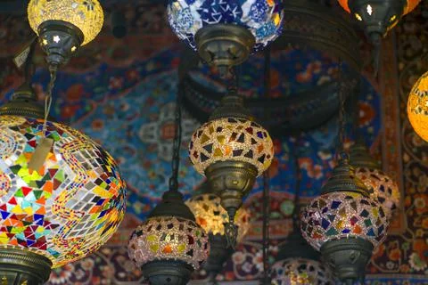 Middle Eastern lambas of different colors and sizes are hanging in the bazaar. Stock Photos