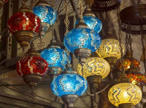 Middle Eastern lambas of different colors and sizes are hanging in the bazaar. Stock Photos