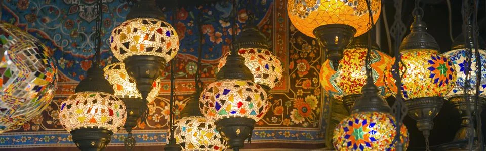 Middle Eastern lambas of different colors and sizes are hanging in the bazaar. Stock Photos