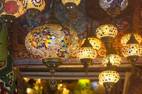 Middle Eastern lambas of different colors and sizes are hanging in the bazaar. Stock Photos