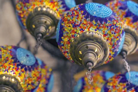 Middle Eastern lambas of different colors and sizes are hanging in the bazaar. Stock Photos