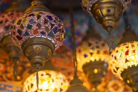 Middle Eastern lambas of different colors and sizes are hanging in the bazaar. Stock Photos