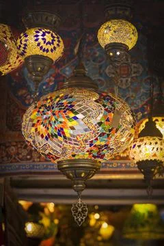 Middle Eastern lambas of different colors and sizes are hanging in the bazaar. Stock Photos