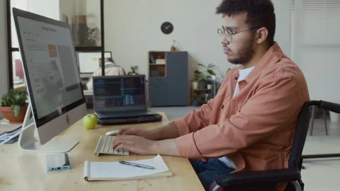 Middle Eastern Male Developer in Wheelchair Working on Code in Office Vídeos de archivo 293171081