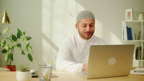 Middle eastern man calling on virtual conference, using laptop. Male person Stock Footage 201274015