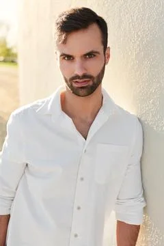 Middle Eastern man leaning on wall Stock Photos