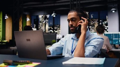 Middle eastern man with reduced mobility in wheelchair on phone call Stock Photos