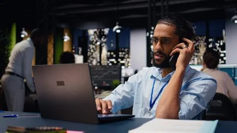 Middle eastern man with reduced mobility in wheelchair on phone call Stock Photos