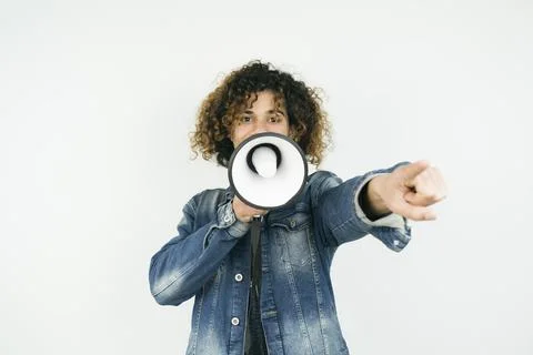 Middle eastern man in shouting through megaphone Stock Photos