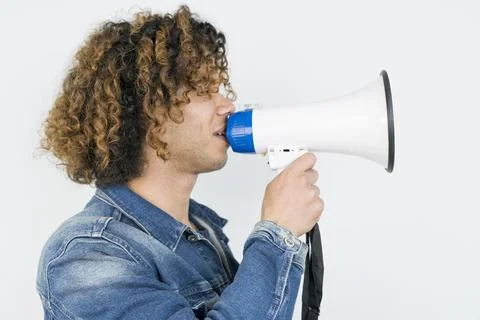 Middle eastern man in shouting through megaphone Stock Photos
