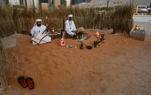 A Middle Eastern man singing and playing music | Arabic culture display Stock Photos