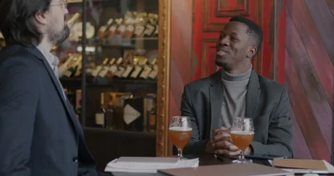 Middle Eastern man in suit coming to business meeting with African American Stock Footage 281823224