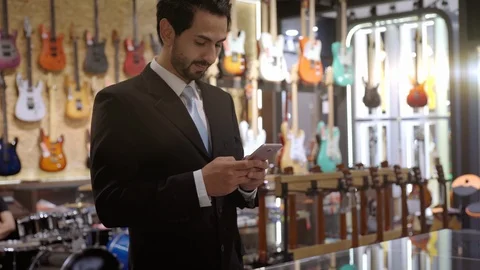 A Middle Eastern Man Using Mobile Phone To Scan QR Code Stock Footage 120383792
