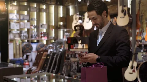 A Middle Eastern Man Using Smartwatch To Purchase Product Stockbeeldmateriaal 120382351