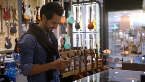 A Middle Eastern Man Using Smartwatch To Purchase Product Stockbeeldmateriaal 120382479