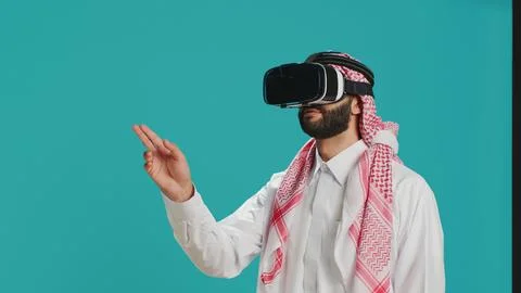 Middle eastern man using vr headset Stock Photos